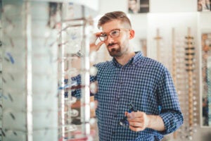 trying glasses on In the optics store