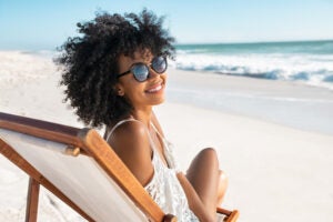 Happy smiling woman in sunglasses