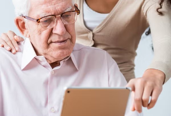 Old man reviewing reports