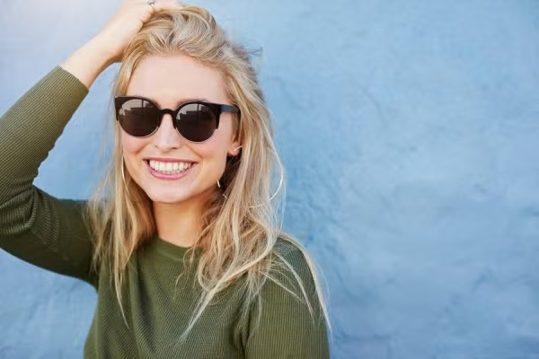 happy women wearing sunglasses
