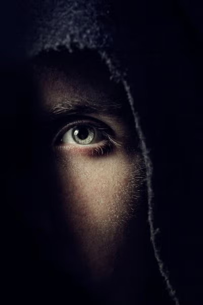 A person locking from the dark