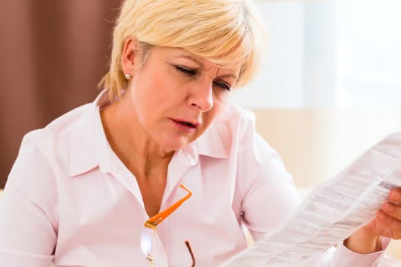 A women reading something on paper