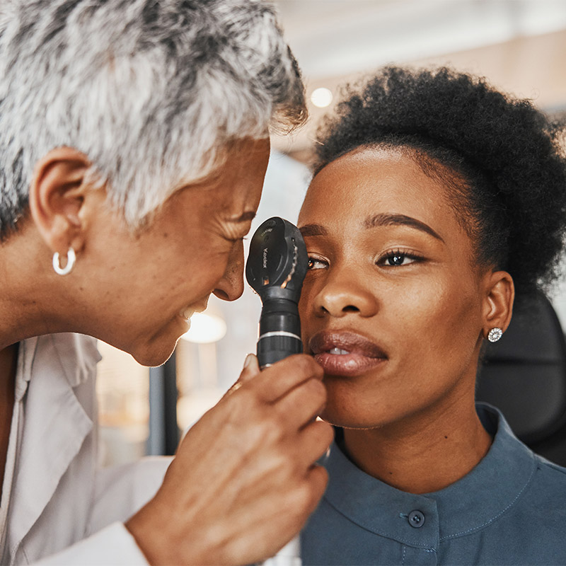 woman getting her eyes checked at doctors office