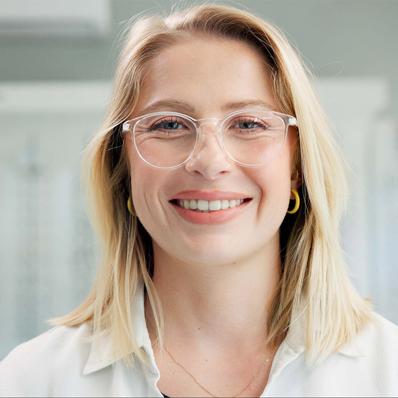 woman with clear frames at eye doctor