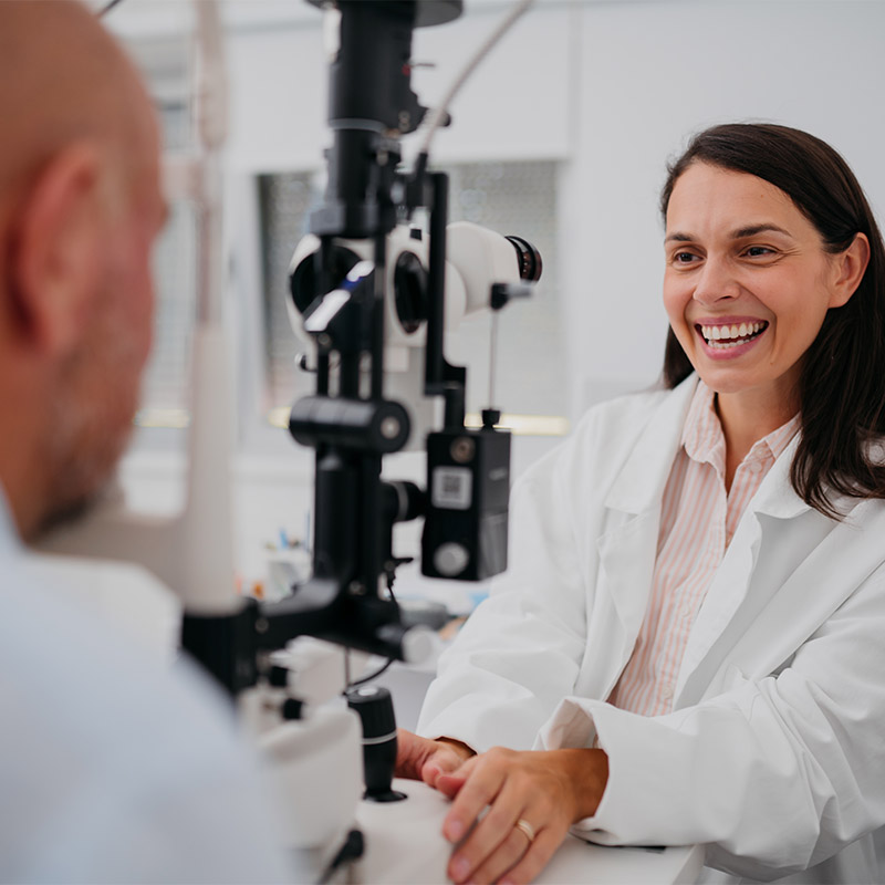 optometrist discussing test with client during eye appointment