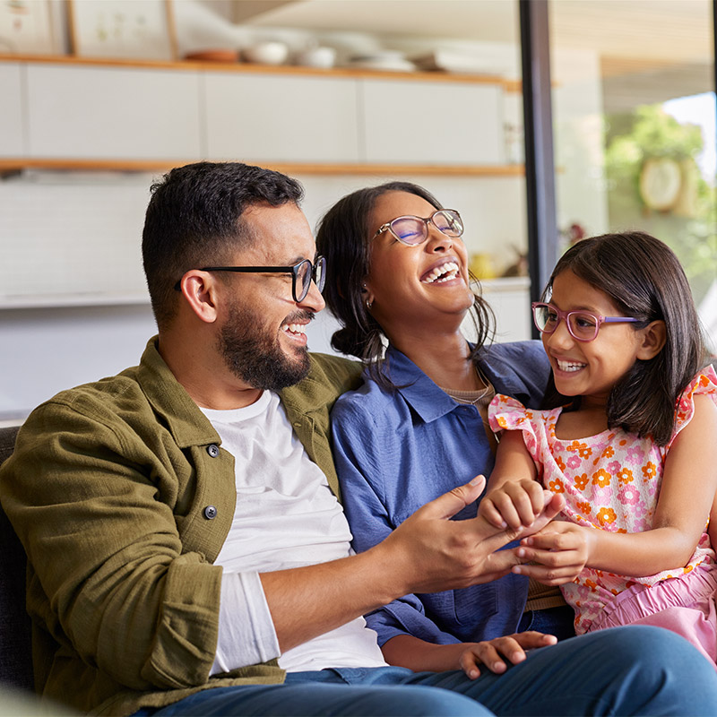 family of three laughing together