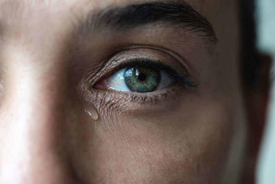 eye drop in a woman's eye