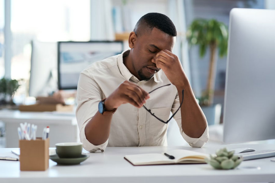 a man stressed from work working on a computer