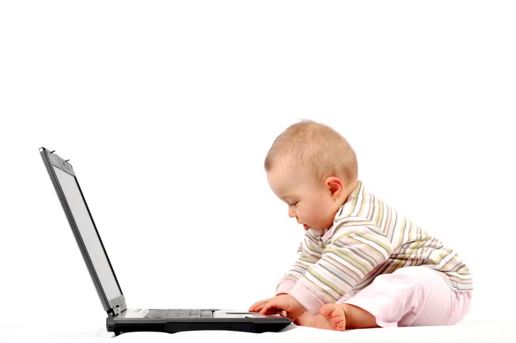 Kid touching a laptop