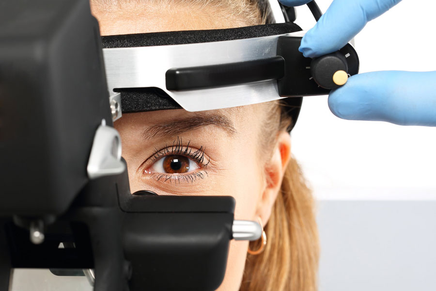 a woman getting an eye checkup